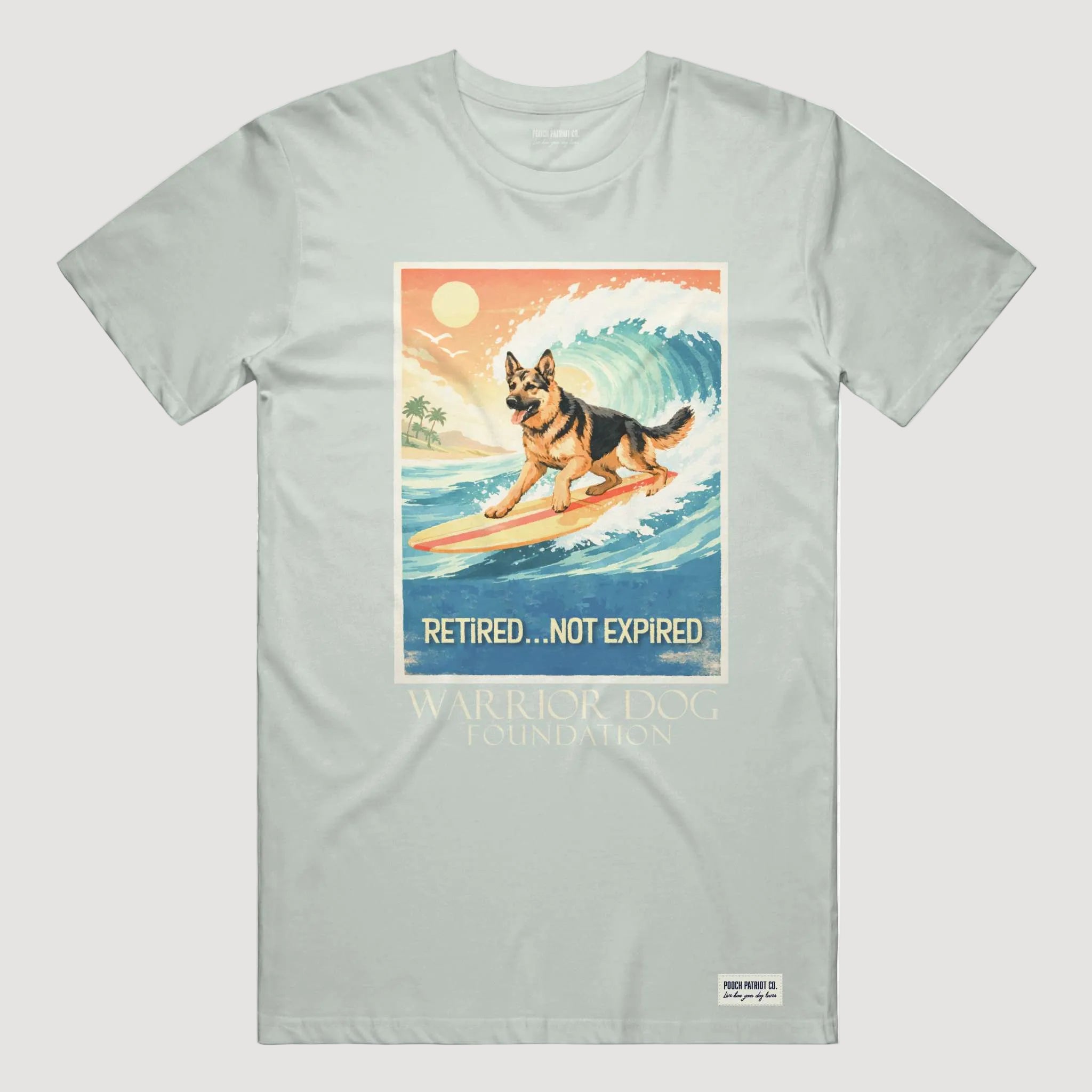 Light gray t-shirt with a graphic of a dog on a surfboard and text 'Retired... Not Expired' on a white background.