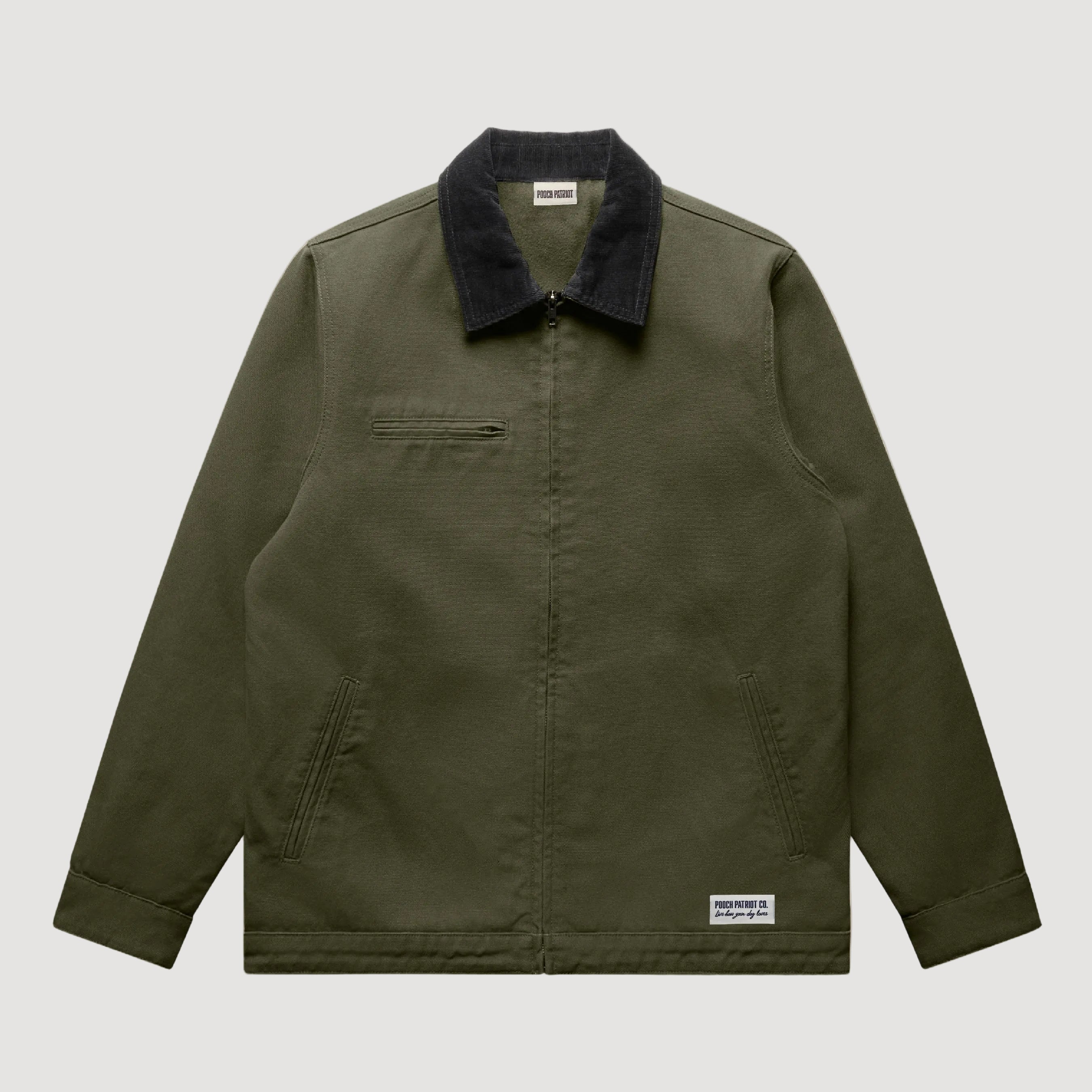 Green jacket with black collar on a beige background