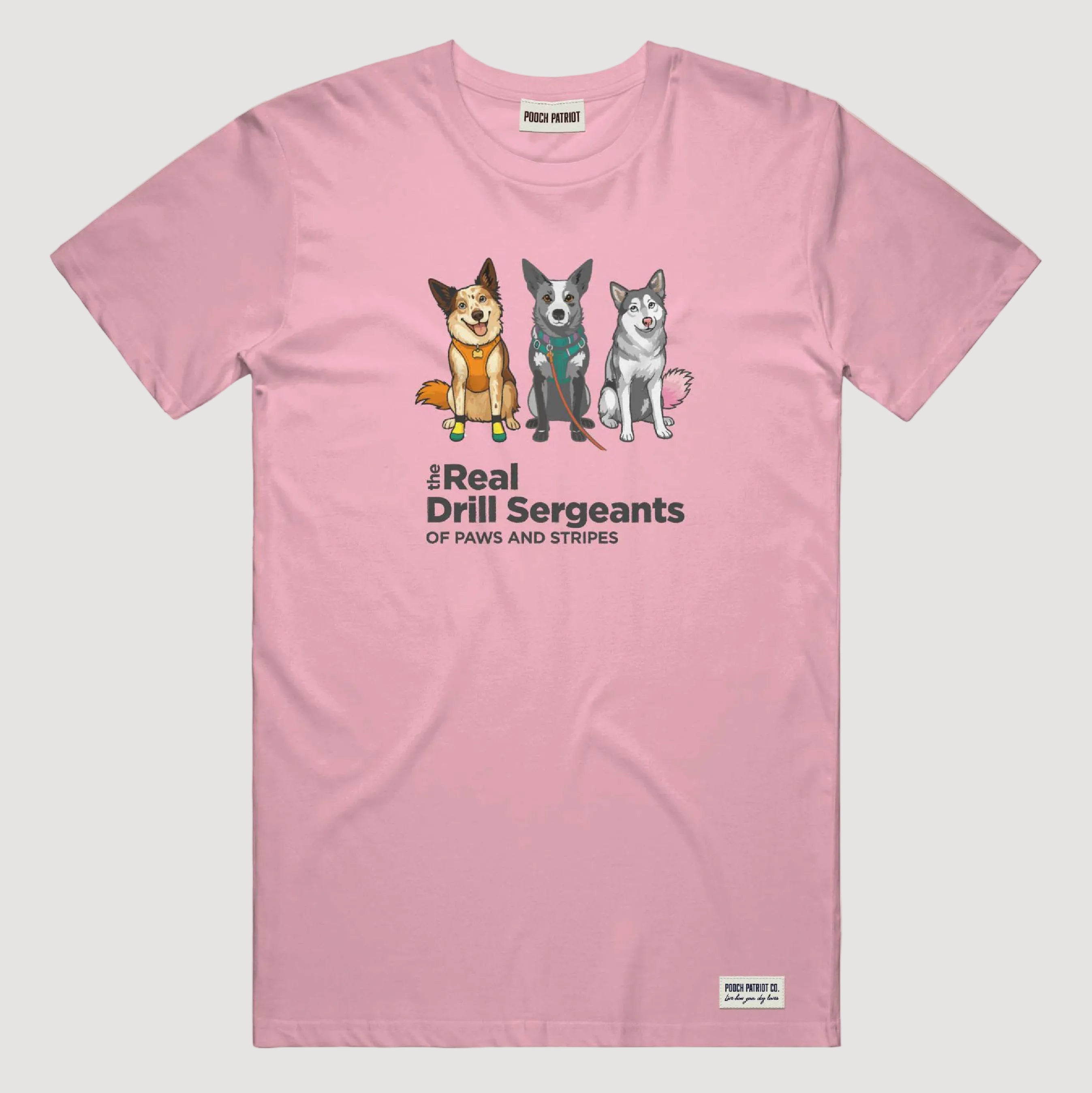 Pink t-shirt with cartoon dogs and text on a beige background