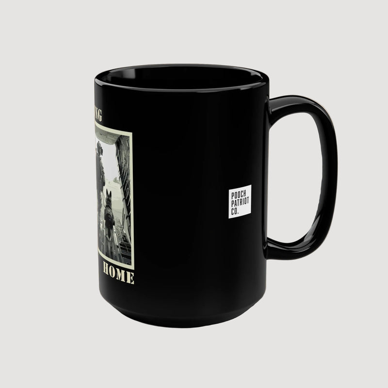 Black mug with a graphic and logo on a beige background