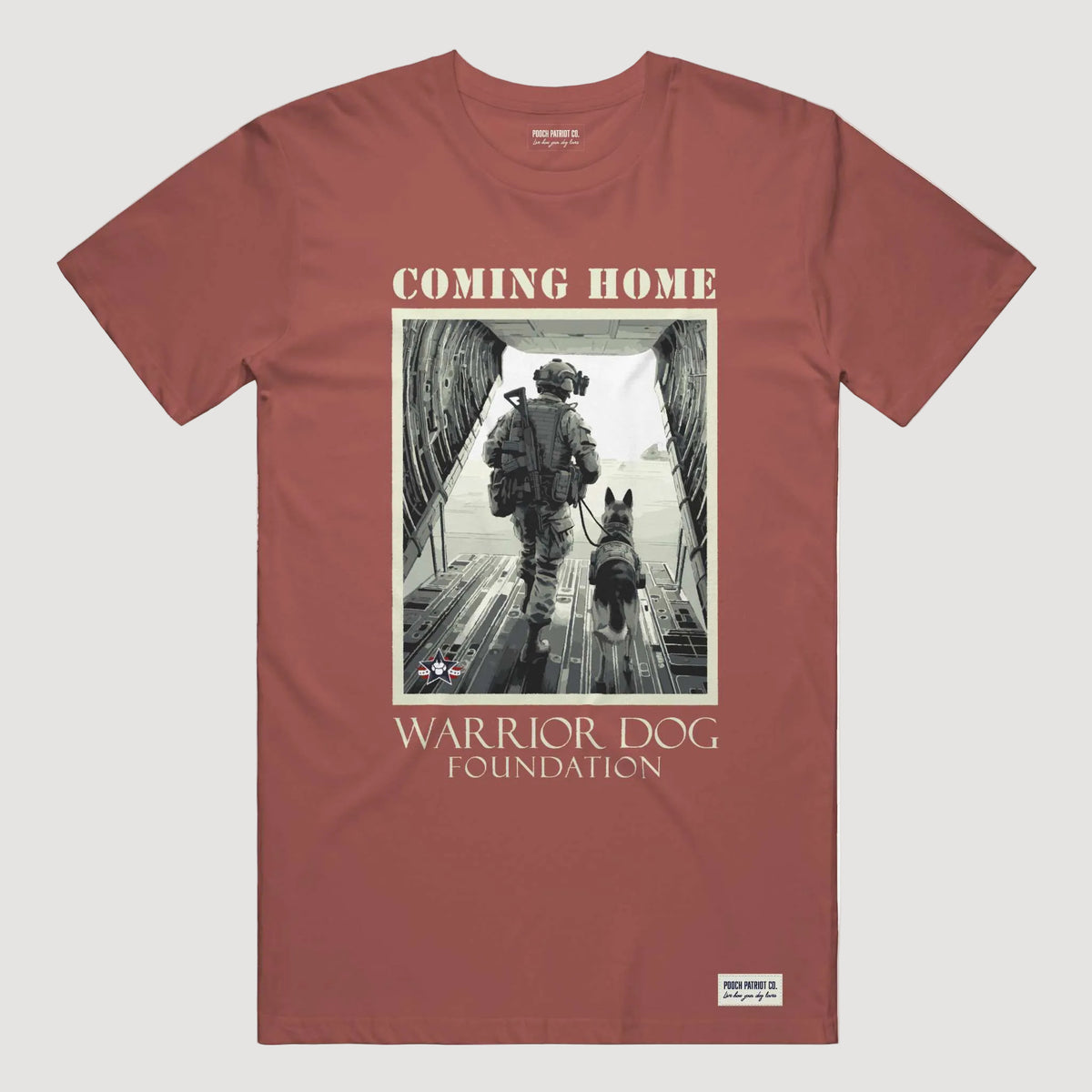 Red t-shirt with a graphic of a soldier and dog and 'Warrior Dog Foundation' text on a white background