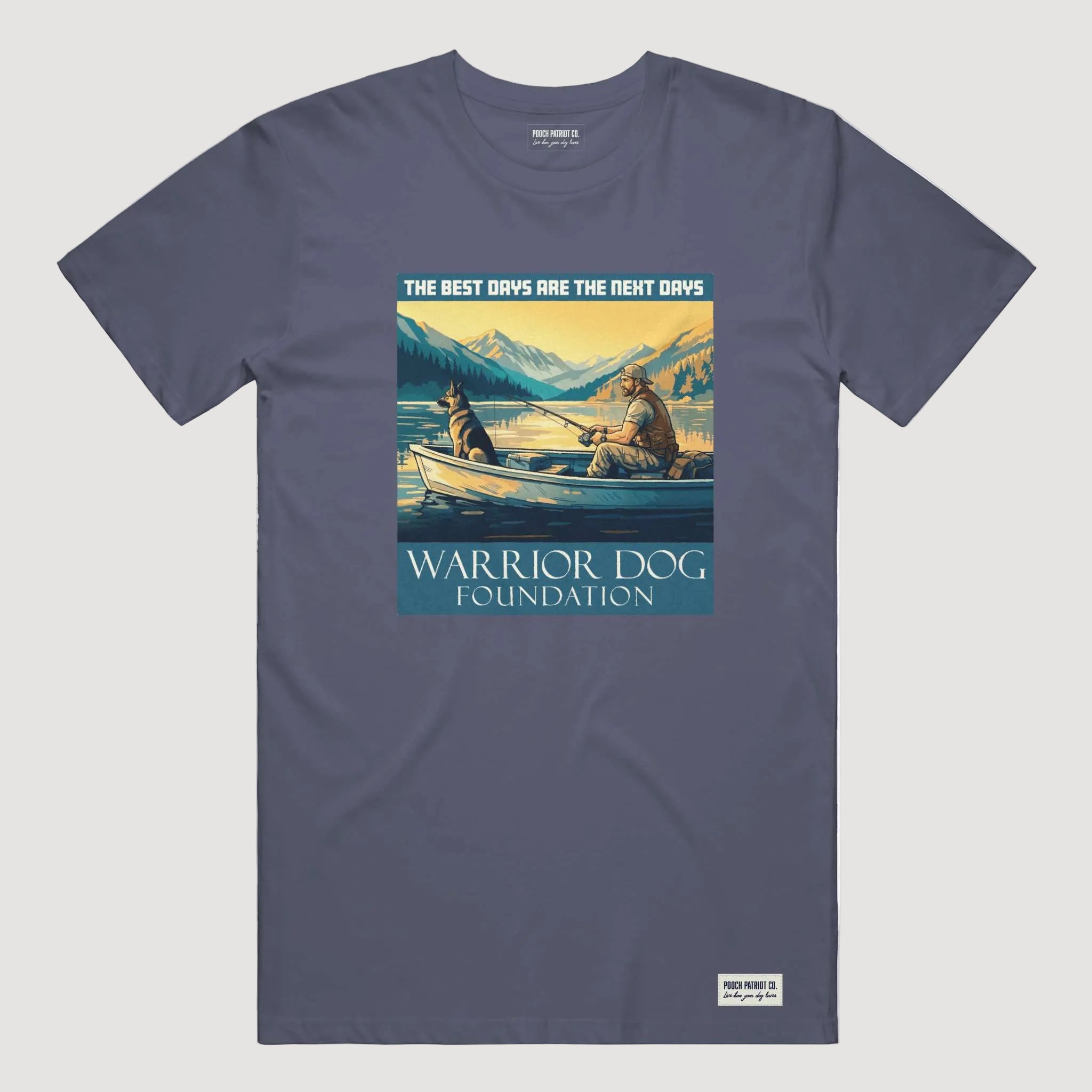 Navy blue t-shirt with a graphic of two people in a boat and mountains, featuring 'Warrior Dog Foundation' text.