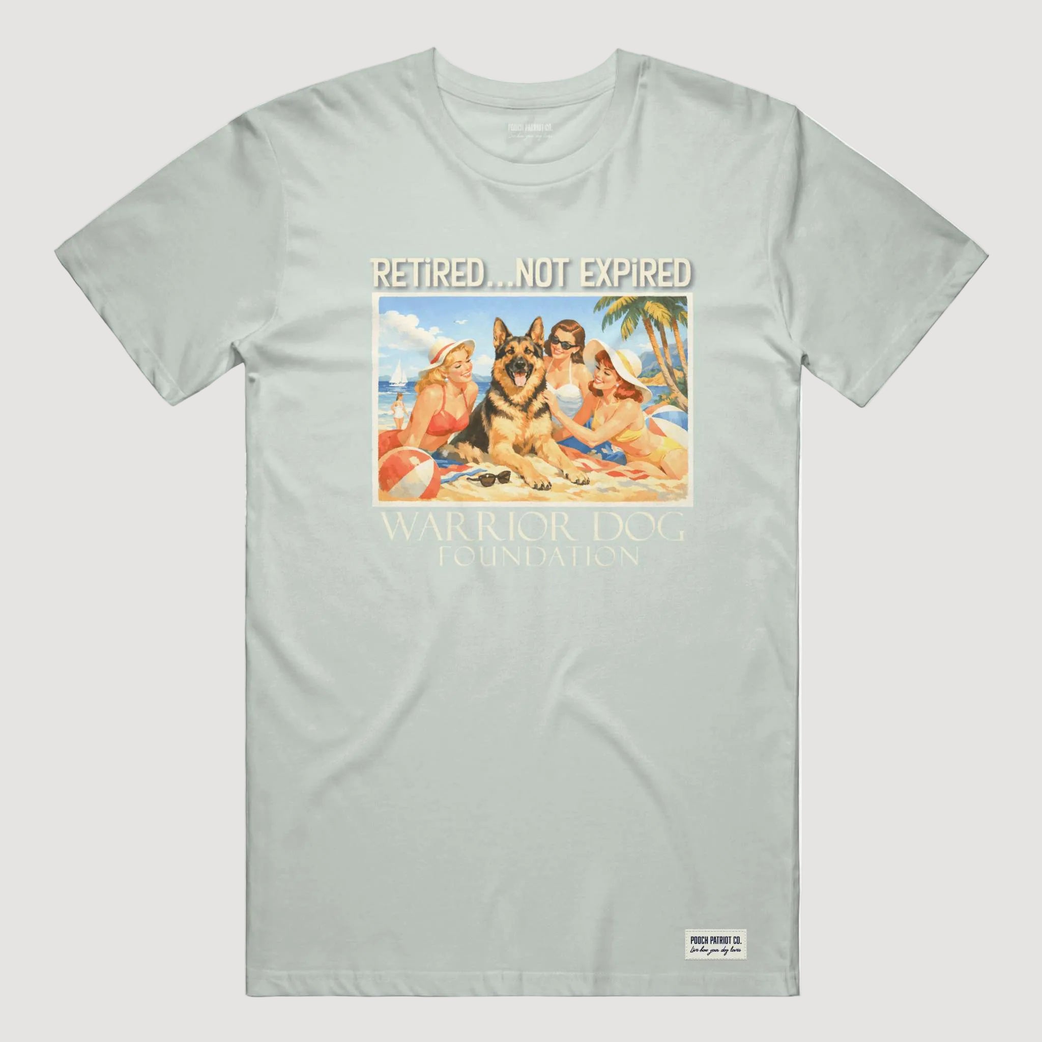 Light gray t-shirt with a graphic of people and a dog on a beach, featuring the text 'Retired.