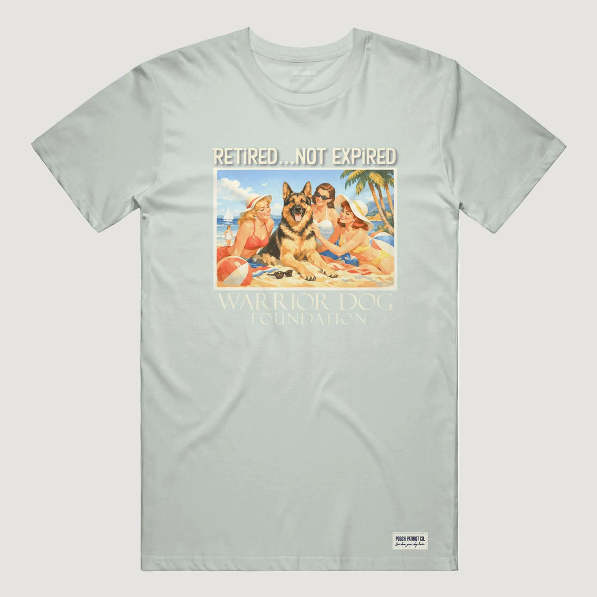 Light gray t-shirt with a graphic of people and a dog on a beach, featuring the text 'Retired.