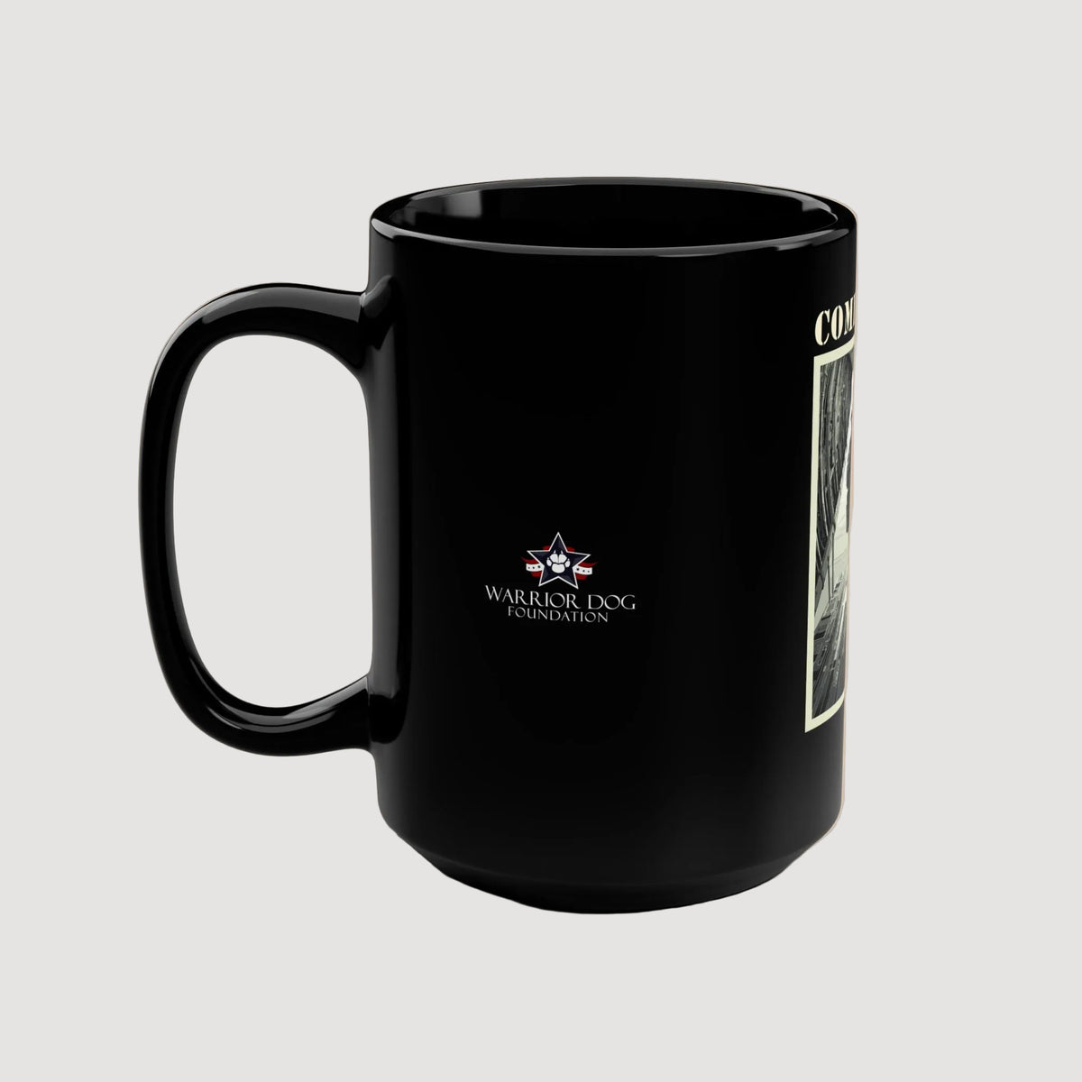 Black mug with Warrior Dog Foundation logo on a beige background