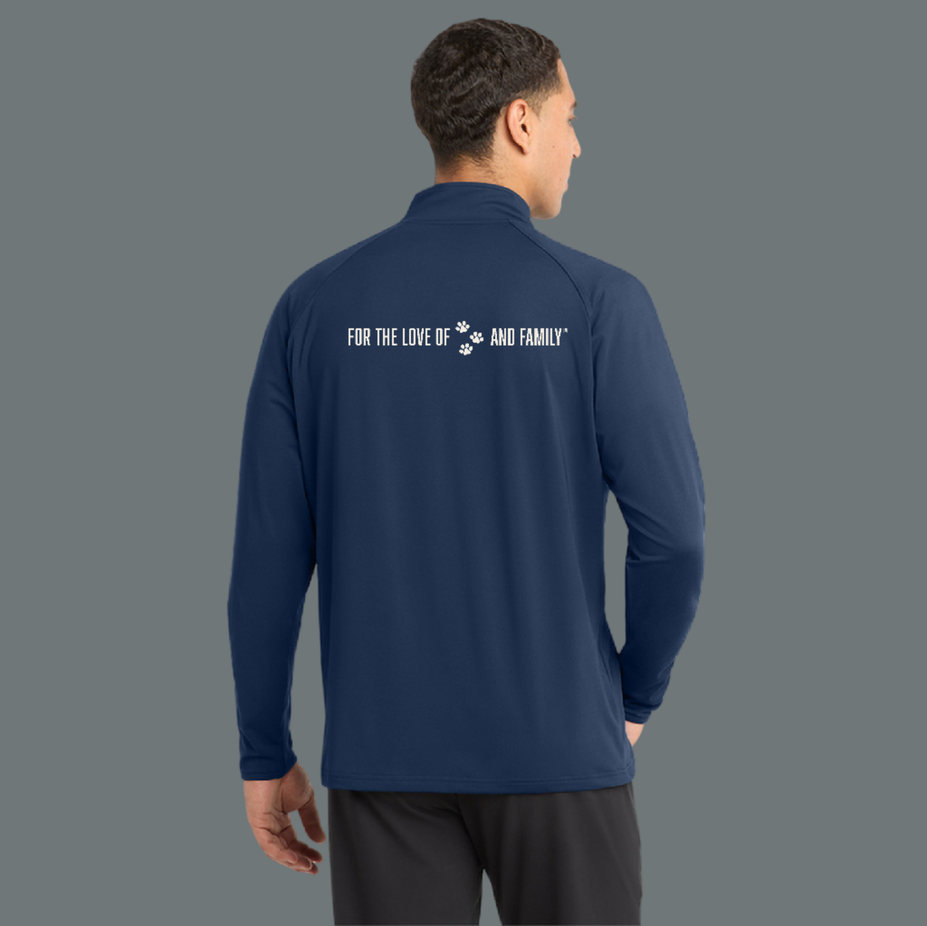 Navy long-sleeve shirt with text on the back, worn by a person on a white background