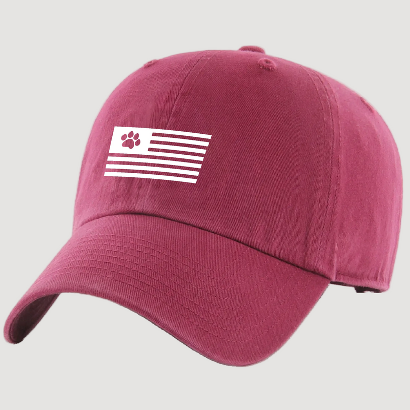 Maroon cap with a white paw print flag design on a white background